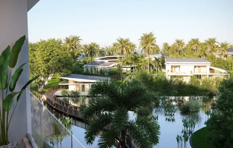 Vista de la piscina y jardines en Playa el Portillo, Las Terrenas, con casas modernas y palmeras.