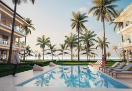 Vista del resort en Las Terrenas con piscina y palmeras.