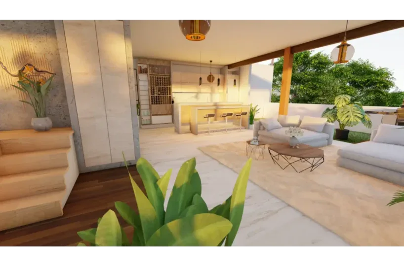 Amplio salón en Las Terrenas con mobiliario blanco y vista a áreas verdes, ideal para relajarse y di.