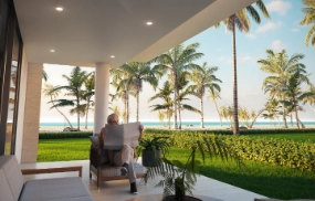 Vista panorámica del mar y palmeras en Las Terrenas desde una terraza moderna.